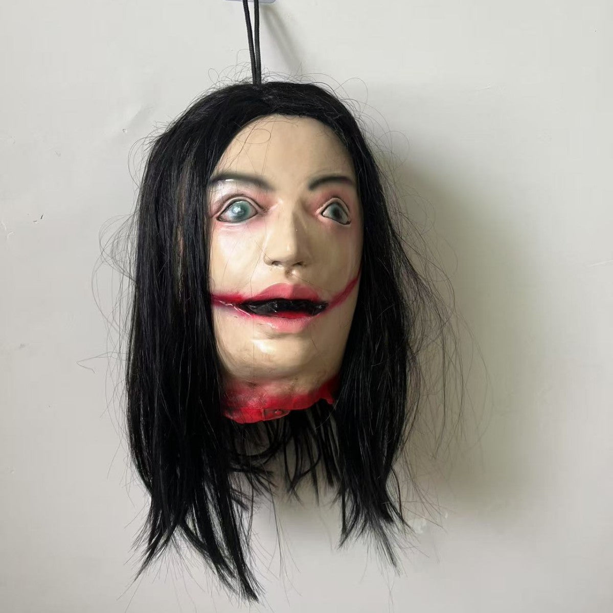 Lifelike Severed Head Horror Prop - 13-inch Hanging Decapitated Zombie Head with Realistic Bloody Details - Spooky Haunted House and Secret Room Decoration